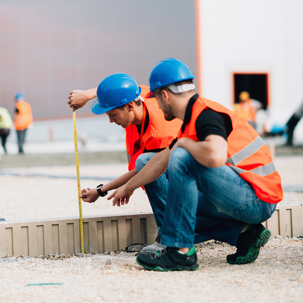 Construction Workers Measuring Construction Workers Measuring